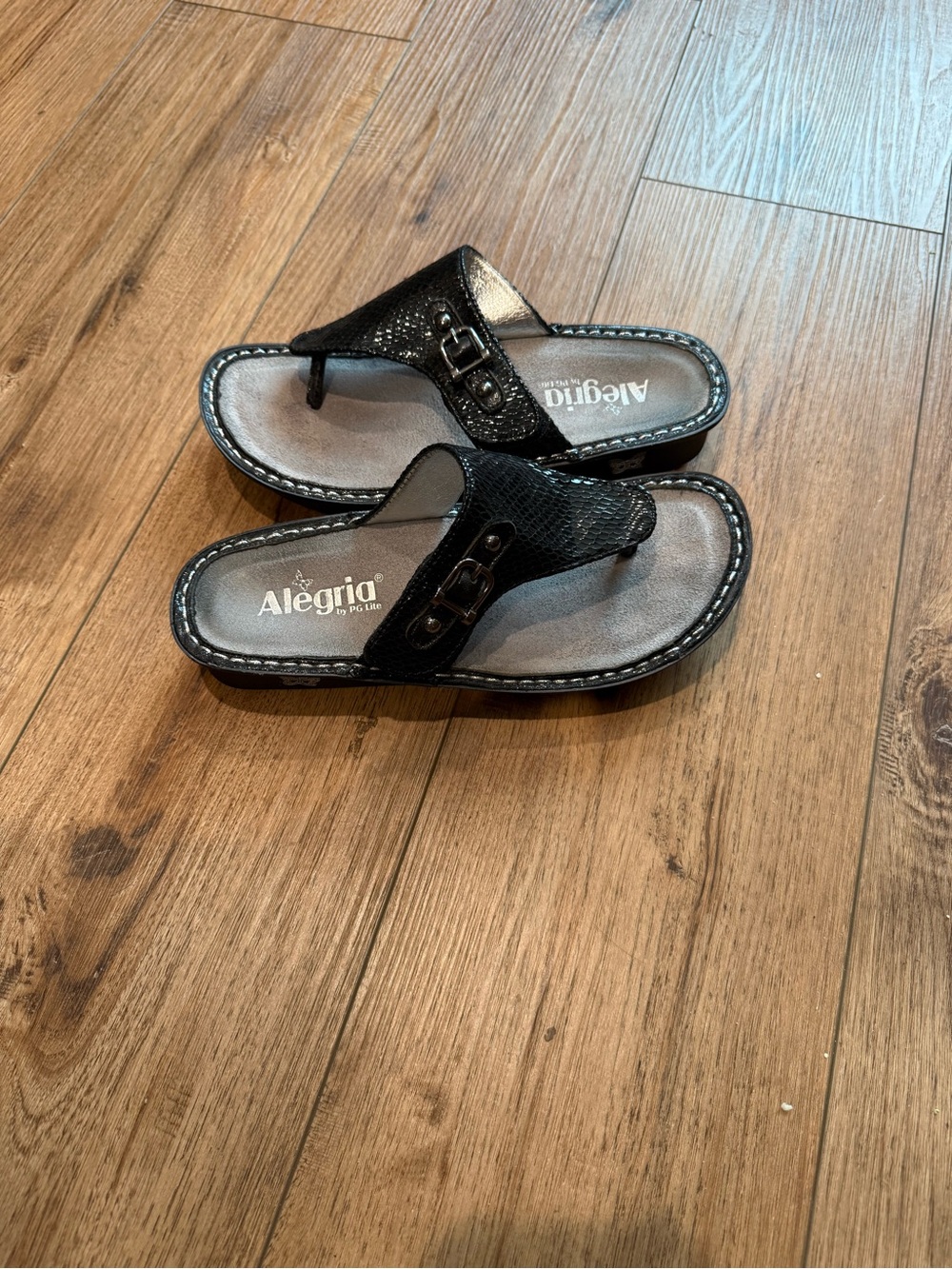 Alegria Black Textured Toe-Post Sandals with Buckle Accent